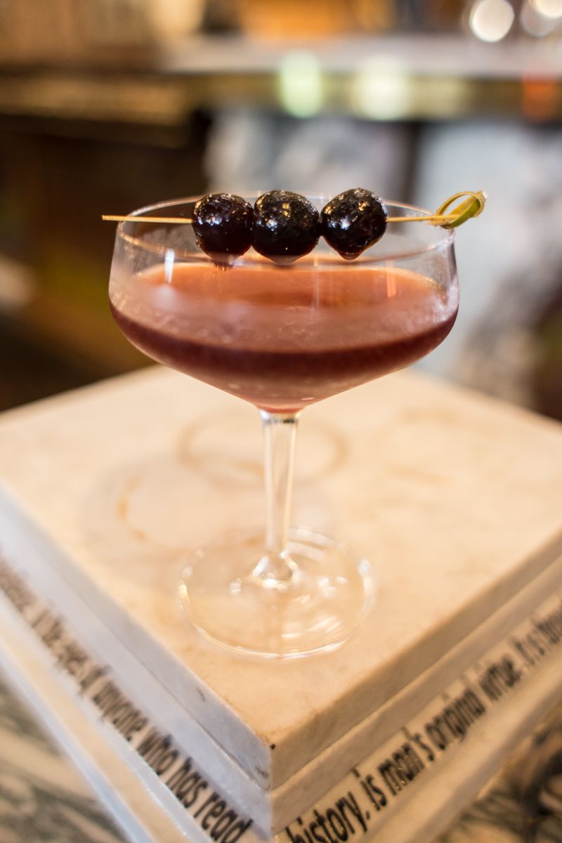 "50 Shades of Dorian Gray" with Plymouth gin, Combire cherry liquor, agave, lemon juice and pinch Chinese 5 spice, with a cherry garnish<br>